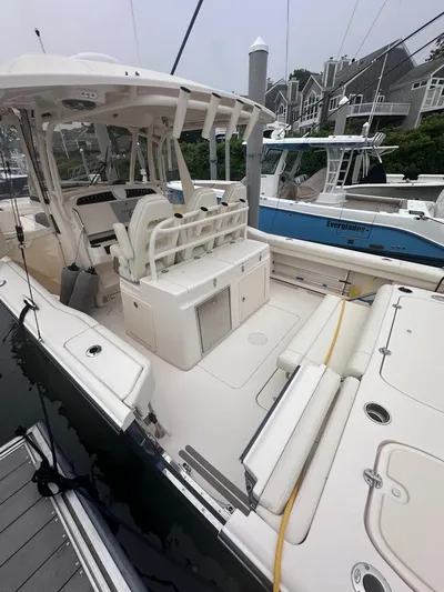  Yacht Photos Pics 2022 Grady-White Canyon 326 boat docked, showcasing spacious deck and seating area.
