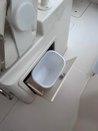  Yacht Photos Pics 2022 Grady-White Canyon 326 boat interior with built-in storage compartment.
