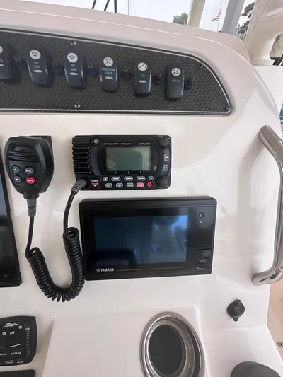  Yacht Photos Pics Control panel of 2022 Grady-White Canyon 326 boat with radio and display.