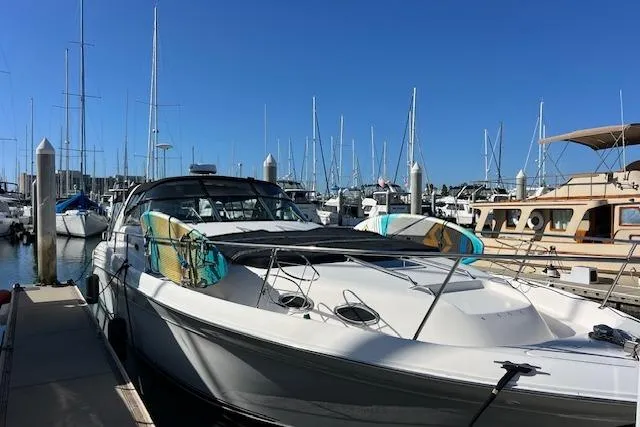 Knot For Sail Yacht Photos Pics 1997 Sea Ray 450 Sundancer yacht docked at marina with clear blue sky.