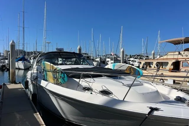 Knot For Sail Yacht Photos Pics 1997 Sea Ray 450 Sundancer yacht docked at marina with clear blue sky.