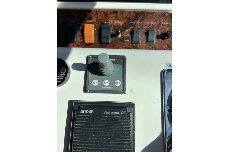 Knot For Sail Yacht Photos Pics Control panel of a 1997 Sea Ray 450 Sundancer boat with switches and joystick.