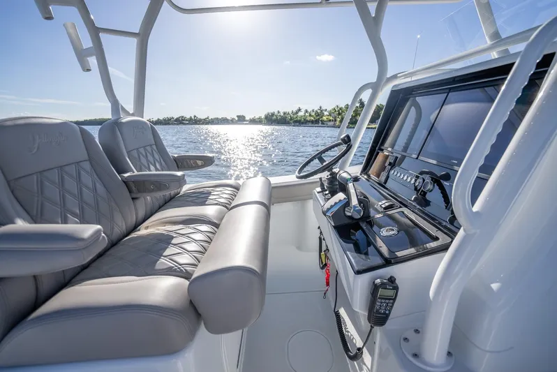  Yacht Photos Pics 2023 Yellowfin 36 boat interior with luxurious seating and advanced navigation controls.