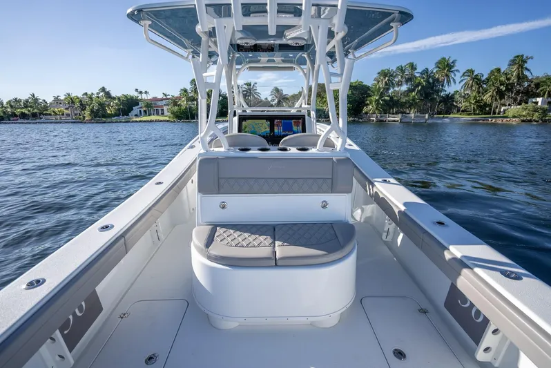  Yacht Photos Pics 2023 Yellowfin 36 boat on water, featuring spacious seating and sleek design.