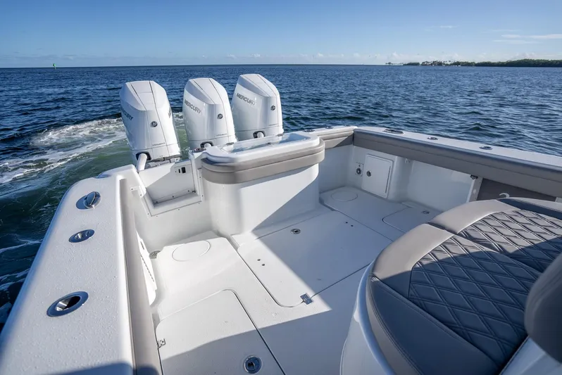  Yacht Photos Pics 2023 Yellowfin 36 boat with triple engines on open water.