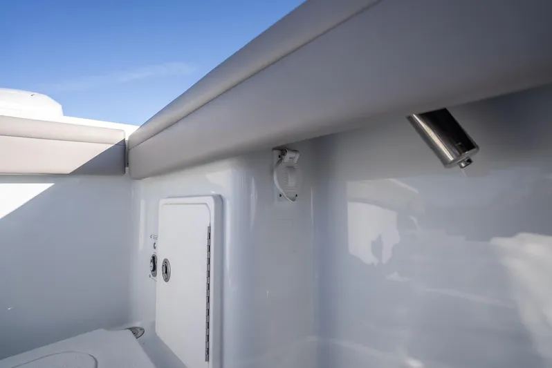  Yacht Photos Pics 2023 Yellowfin 36 boat interior with storage compartment and sleek design.