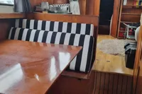 Interior of 1987 Zijlmans Kruiser with wooden finish and striped seating.