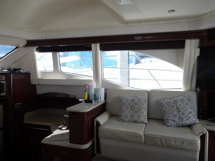  Yacht Photos Pics Interior of 2008 Sea Ray 44 Sedan Bridge yacht with sofa and windows.