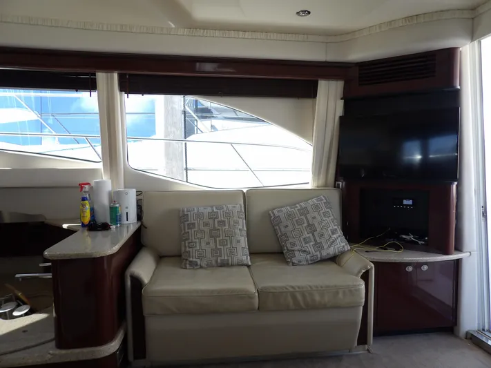  Yacht Photos Pics Interior of 2008 Sea Ray 44 Sedan Bridge yacht with sofa and TV.