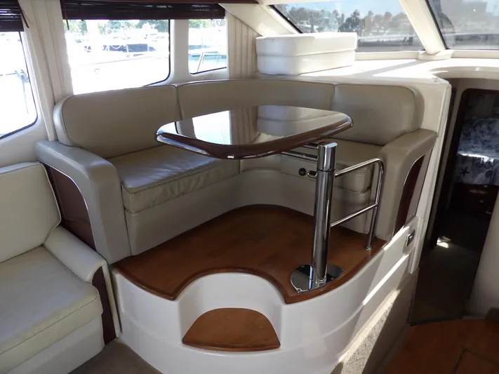  Yacht Photos Pics Luxurious 2008 Sea Ray 44 Sedan Bridge interior with elegant seating and table.