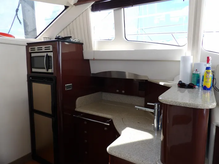  Yacht Photos Pics 2008 Sea Ray 44 Sedan Bridge yacht kitchen with modern appliances and sleek countertops.