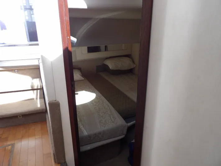  Yacht Photos Pics 2008 Sea Ray 44 Sedan Bridge cabin with twin beds and wooden flooring.