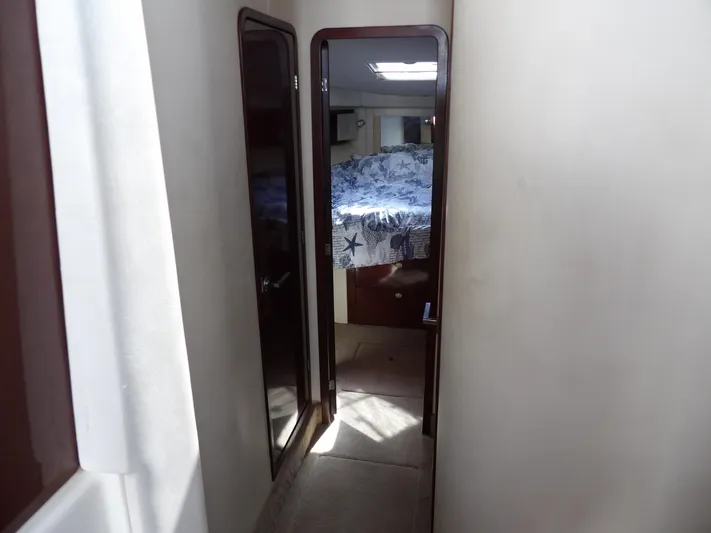  Yacht Photos Pics Interior hallway of 2008 Sea Ray 44 Sedan Bridge yacht, leading to a bedroom.