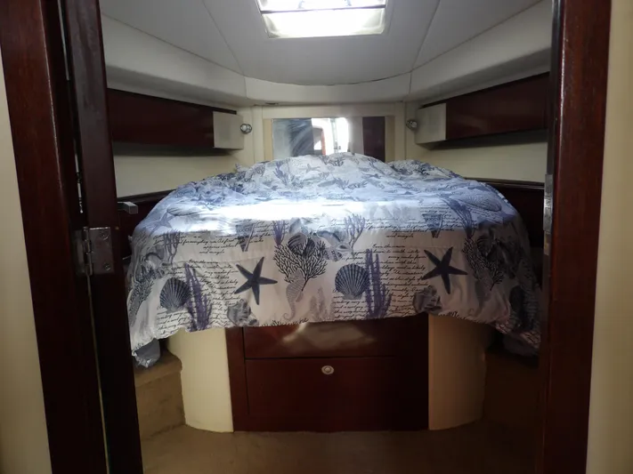  Yacht Photos Pics 2008 Sea Ray 44 Sedan Bridge cabin with nautical-themed bedding.