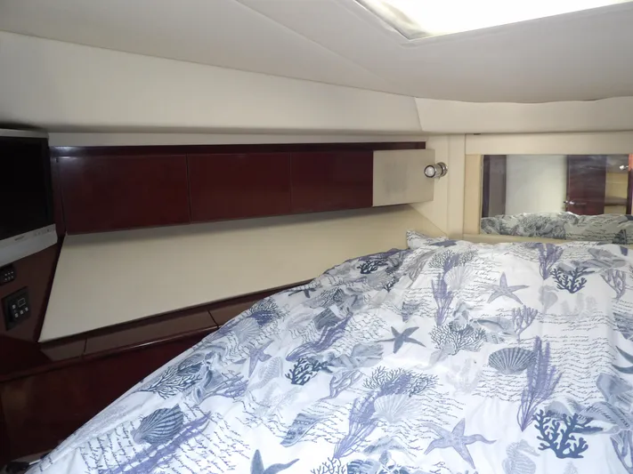  Yacht Photos Pics Luxurious 2008 Sea Ray 44 Sedan Bridge cabin interior with elegant bedding and wood cabinetry.