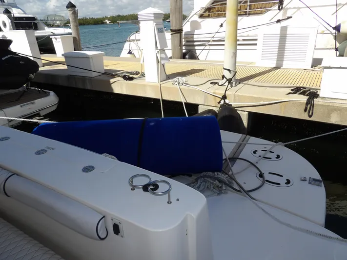  Yacht Photos Pics 2008 Sea Ray 44 Sedan Bridge docked at marina with blue fender.