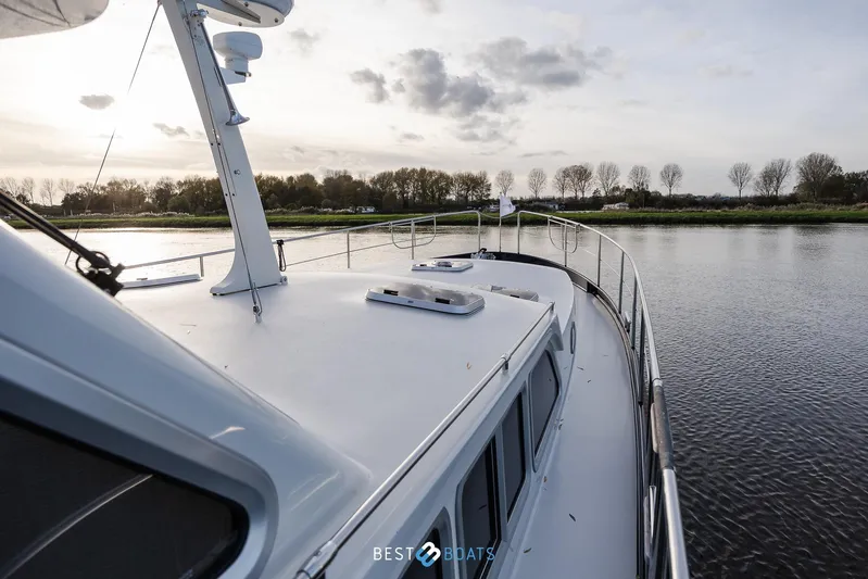  Yacht Photos Pics 2017 Linssen Grand Sturdy 470 Wheelhouse yacht cruising on a serene river at sunset.