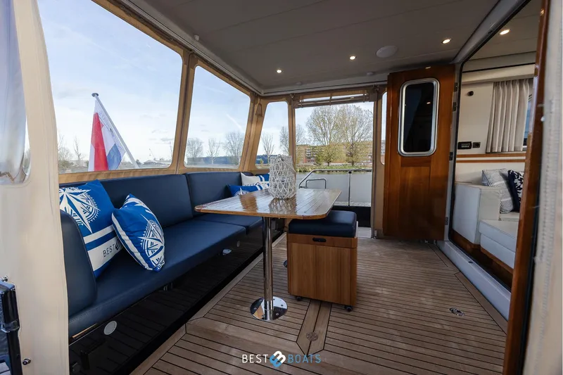  Yacht Photos Pics Linssen Grand Sturdy 470 Wheelhouse 2017 interior with seating and table, featuring elegant wood finishes.