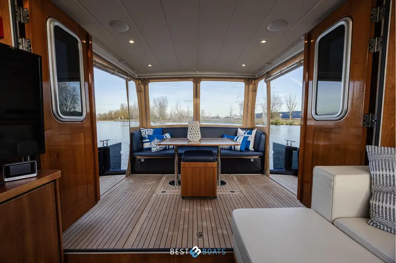  Yacht Photos Pics Luxurious interior of 2017 Linssen Grand Sturdy 470 Wheelhouse with elegant wood finish and seating.