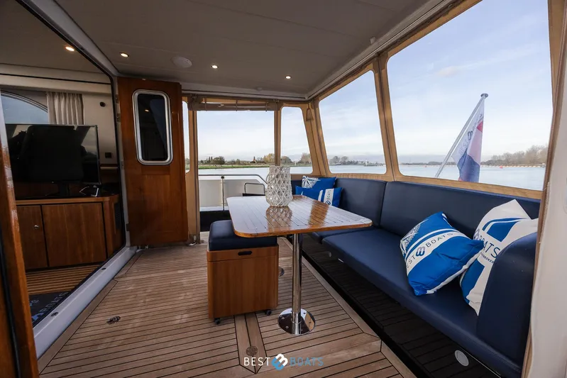  Yacht Photos Pics Luxurious interior of 2017 Linssen Grand Sturdy 470 Wheelhouse yacht with elegant seating and table.