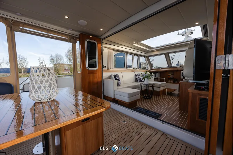  Yacht Photos Pics Interior of 2017 Linssen Grand Sturdy 470 Wheelhouse, featuring elegant wood finishes and comfortable seating.