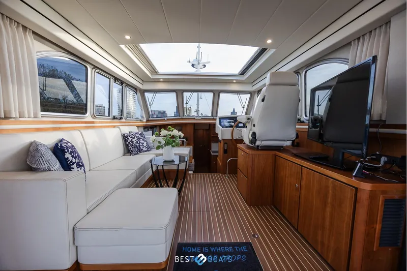  Yacht Photos Pics Luxurious interior of 2017 Linssen Grand Sturdy 470 Wheelhouse with elegant seating and modern amenities.