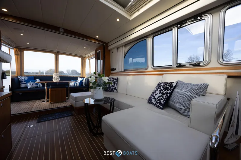  Yacht Photos Pics Luxurious interior of 2017 Linssen Grand Sturdy 470 Wheelhouse with elegant seating and decor.