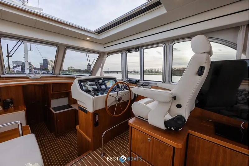  Yacht Photos Pics Luxurious 2017 Linssen Grand Sturdy 470 Wheelhouse interior with panoramic windows and captain's chair.