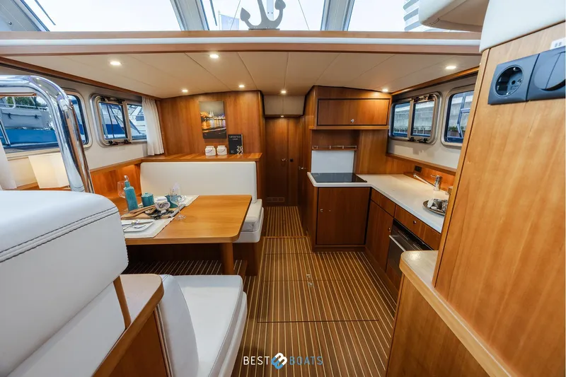  Yacht Photos Pics Luxurious interior of 2017 Linssen Grand Sturdy 470 Wheelhouse with elegant wood finish.