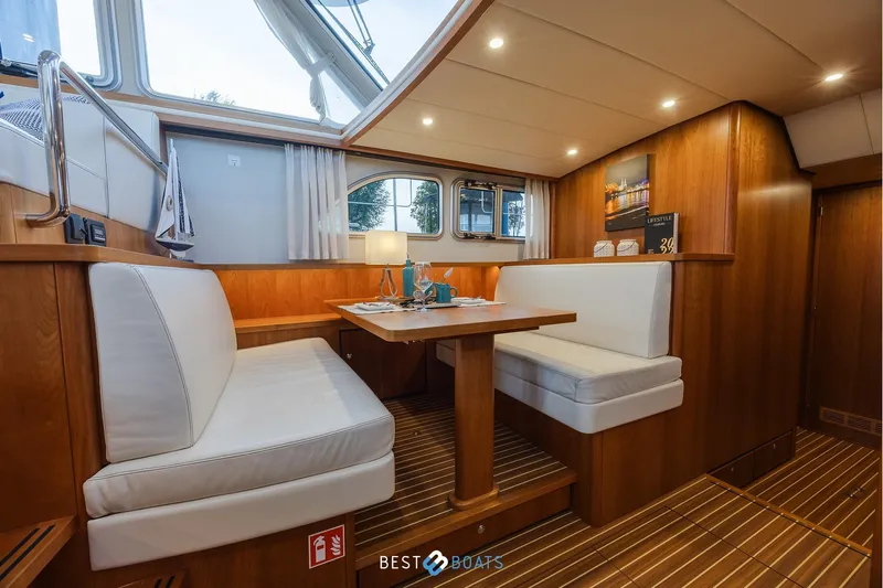  Yacht Photos Pics Luxurious interior of 2017 Linssen Grand Sturdy 470 Wheelhouse with elegant wood finish.
