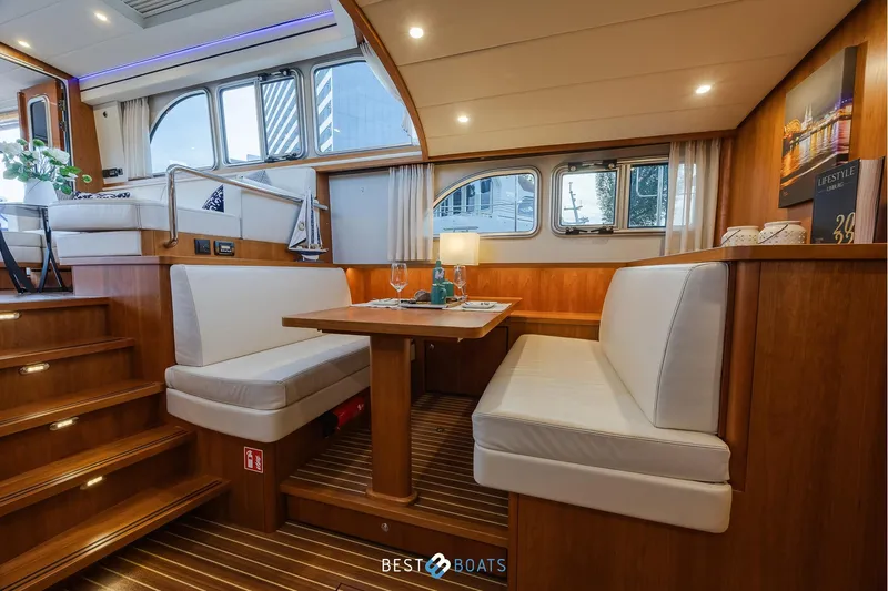  Yacht Photos Pics Luxurious interior of 2017 Linssen Grand Sturdy 470 Wheelhouse with elegant dining area.