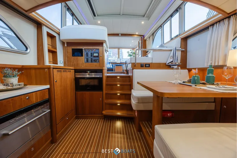  Yacht Photos Pics Luxurious interior of 2017 Linssen Grand Sturdy 470 Wheelhouse yacht with elegant wood finish.