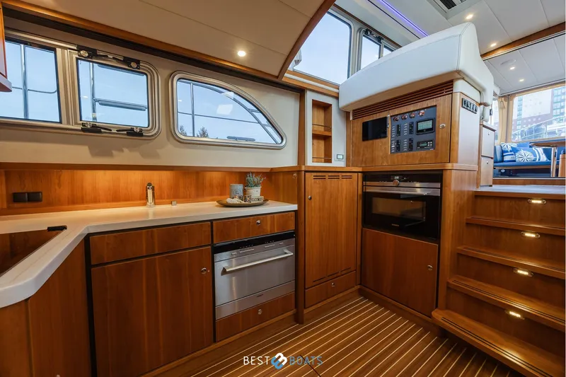  Yacht Photos Pics Luxurious interior of 2017 Linssen Grand Sturdy 470 Wheelhouse yacht with modern kitchen amenities.