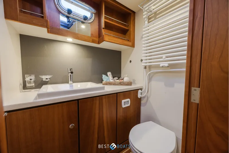  Yacht Photos Pics Bathroom interior of 2017 Linssen Grand Sturdy 470 Wheelhouse yacht, featuring sink and toilet.