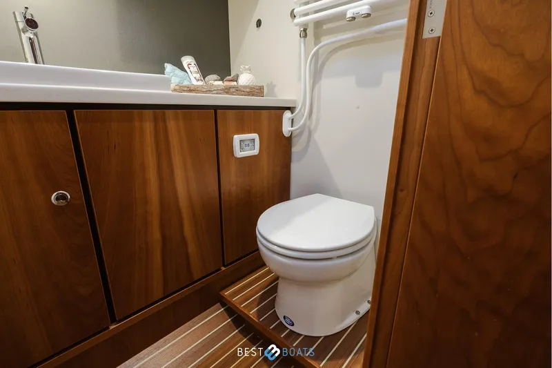  Yacht Photos Pics Luxurious bathroom in 2017 Linssen Grand Sturdy 470 Wheelhouse yacht, featuring wooden cabinetry.