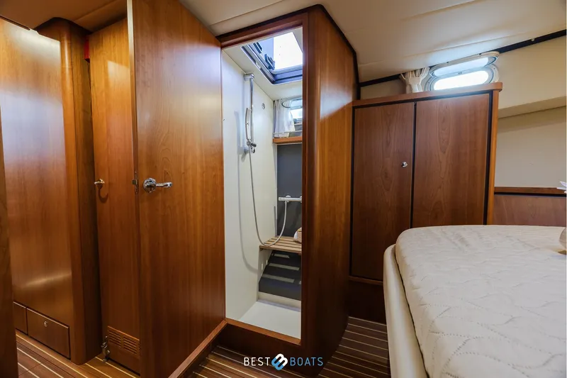  Yacht Photos Pics Interior of 2017 Linssen Grand Sturdy 470 Wheelhouse, featuring wood paneling and a shower area.