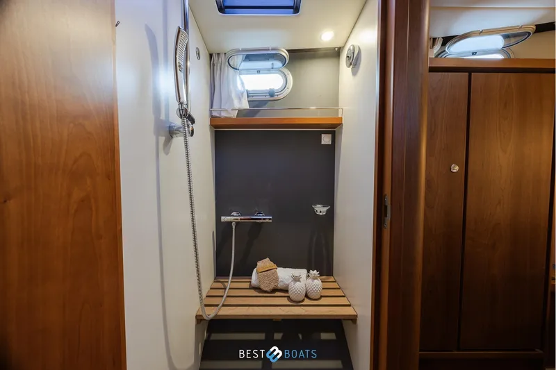  Yacht Photos Pics Shower area in 2017 Linssen Grand Sturdy 470 Wheelhouse yacht, featuring wooden accents.