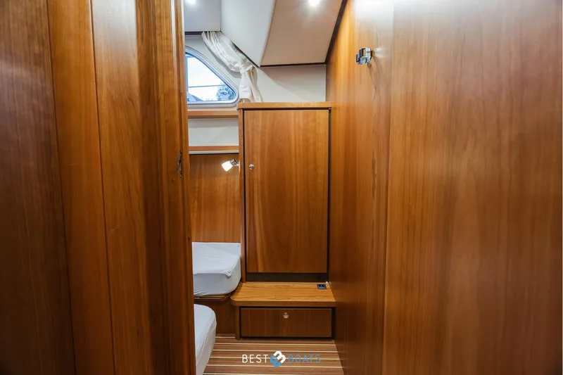  Yacht Photos Pics 2017 Linssen Grand Sturdy 470 Wheelhouse interior with wooden cabinetry and cozy sleeping area.