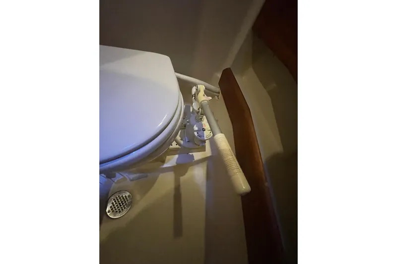  Yacht Photos Pics Marine toilet with manual pump handle on a 1999 Hunter 460 yacht.