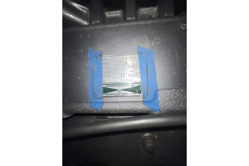  Yacht Photos Pics Close-up of a Hunter 460 engine plate, model year 1999, with blue tape.