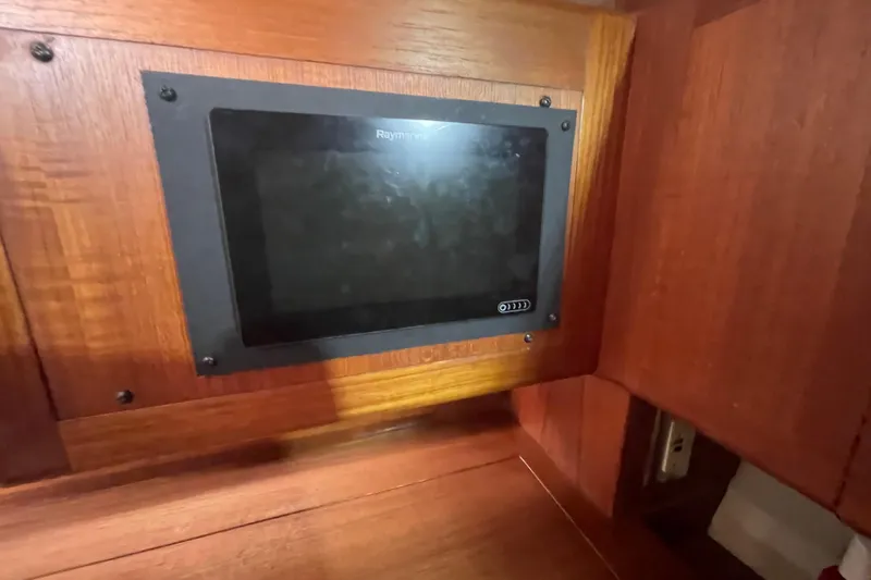  Yacht Photos Pics Raymarine display panel on 1999 Hunter 460 yacht's wooden interior.