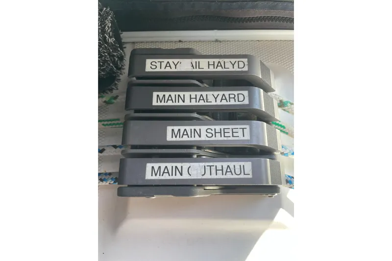  Yacht Photos Pics Sailboat control lines labeled: Stay Sail Halyard, Main Halyard, Main Sheet, Main Outhaul. Hunter 460, 1999.