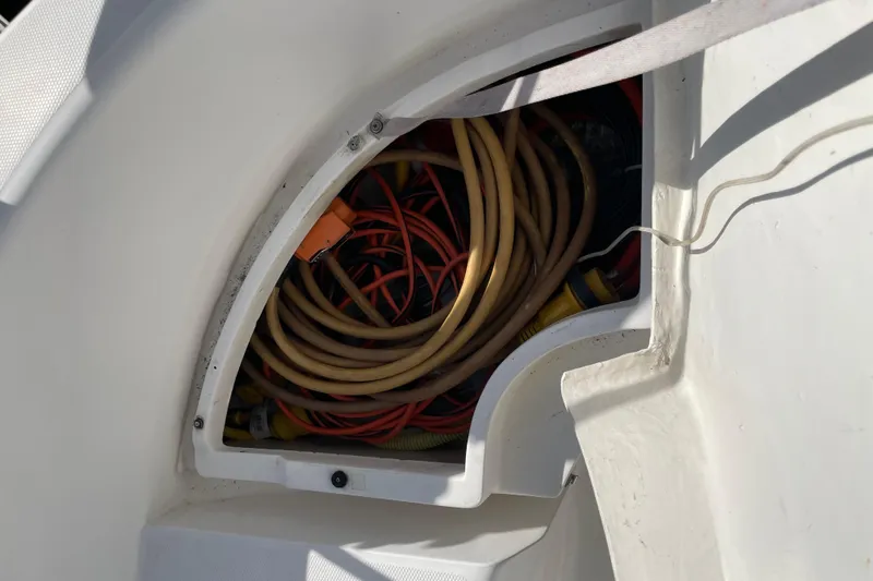  Yacht Photos Pics Storage compartment with coiled cables on a 1999 Hunter 460 boat.