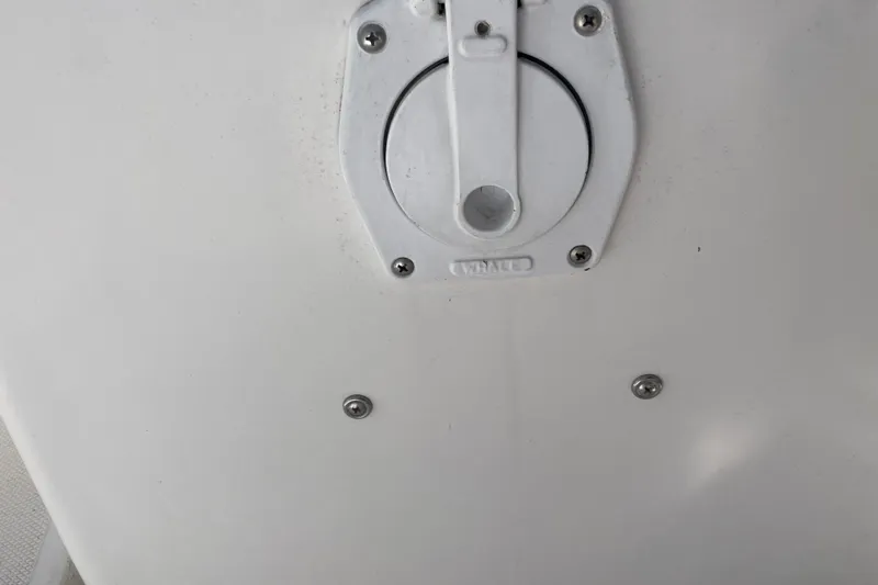  Yacht Photos Pics White panel with a circular hatch on a 1999 Hunter 460 boat.