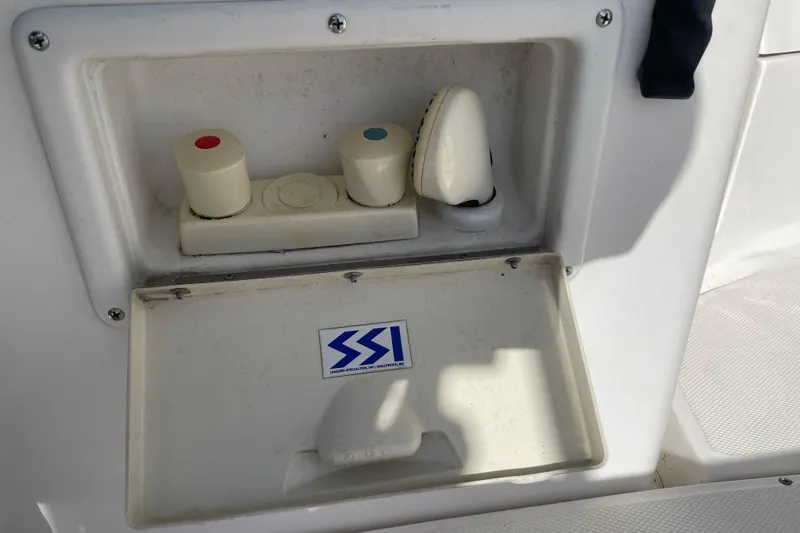  Yacht Photos Pics Hunter 460 (1999) boat shower controls with SSI sticker, featuring hot and cold knobs.