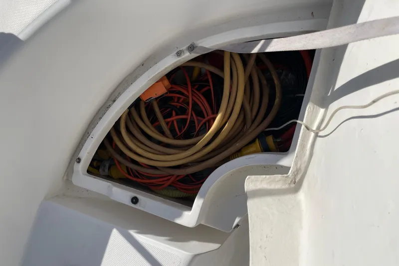  Yacht Photos Pics Storage compartment with coiled cables on a 1999 Hunter 460 boat.