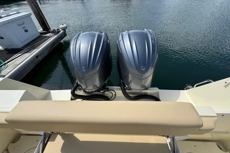  Yacht Photos Pics Twin outboard motors on a 2026 NorthCoast 285 HT boat at a dock.