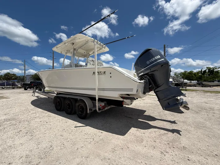  Yacht Photos Pics 2014 Jupiter 30 FS boat on trailer with Yamaha outboard motor under clear blue sky.