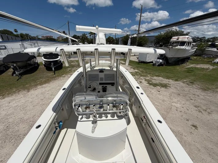  Yacht Photos Pics 2014 Jupiter 30 FS boat interior with helm, parked outdoors under blue sky.