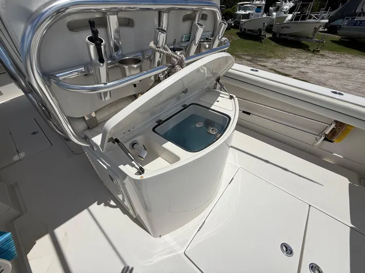  Yacht Photos Pics 2014 Jupiter 30 FS boat with open storage compartment and fishing rod holders.
